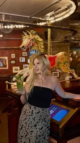 A group of friends visits Flight Club in Edinburgh to play social darts, enjoy cocktails, and share a variety of food including pizza, sliders, and tacos. The video captures the fun atmosphere and the interactive nature of the venue.