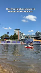 A short vlog showcasing the free lido at Royal Victoria Dock in London, highlighting the open-water swimming, sandy play areas, and city views.