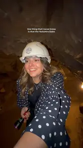 The video is a vlog-style tour of Stump Cross Caverns in the Yorkshire Dales. It follows the creator as they explore the caves, visit the gift shop to crack open a geode, and enjoy an afternoon tea in the on-site cafe.