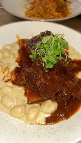 A food-focused reel showcasing various Italian dishes at Ornella's Kitchen, including arancini, pasta, gnocchi, and tiramisu, with a focus on the quality and generous portion sizes.