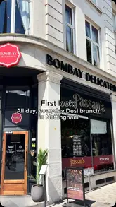 A promotional reel showcasing the new all-day Desi brunch menu at Bombay Delicatessen in Nottingham, featuring close-up shots of traditional dishes like Aloo Puri, Makki Di Roti, and Amritsari Kulcha, paired with mango lassi.