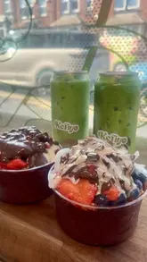 A short, aesthetic video showcasing açaí bowls and iced matcha drinks from Kefiyo in Leeds, focusing on the toppings and textures.