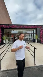 A food reviewer visits Esto's at Signature Mall in Bradford, showcasing their Turkish grilled meats, specifically the wings and shawarma wrap, and providing a positive review of the food quality and the venue's late-night opening hours.