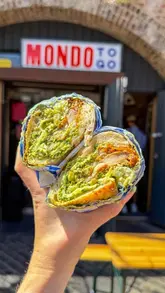A fast-paced listicle video featuring six different hospitality venues in Deptford, London. The creator visits a bakery, a brunch spot, a sandwich shop, an Irish-Chinese takeaway, a wine bar, and a Vietnamese restaurant, providing quick glimpses of the food and atmosphere at each location.