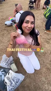A vlog-style video showcasing a visit to a Thai festival in Cambridge, highlighting the atmosphere, live music, and various street food items like Thai milk tea, a corn dog, and roti.