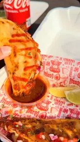 A short promotional video for a food truck called Letseat, showcasing their birria tacos and birria pizza, including close-ups of the food and dipping action.