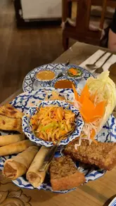 A short video showcasing a visit to Thailanna, a Thai restaurant in Walsall, highlighting their sharing starter platter, beer, rice, and red curry.