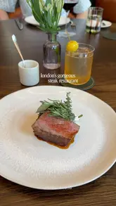 A high-quality, cinematic montage showcasing the interior, cocktails, and fine dining dishes at Cooper's Cut, located within the Four Seasons Hotel at Tower Bridge.