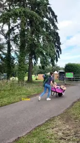 A family vlog showcasing a camping trip at Dalkeith Country Park, including staying in pre-pitched bell tents, participating in a Go Ape adventure course, and dining at The Kitchen restaurant.