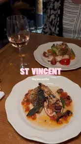 A short montage showcasing the exterior, wine selection, and various dishes at St. Vincent in Newcastle.
