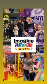 A promotional video showcasing the various interactive zones and activities at Imagine That in Wigan, including science experiments, role-play stations, and creative workshops.