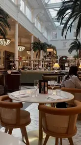 A polished montage showcasing the facilities and dining experiences at The Municipal Hotel in Liverpool, including the lobby, spa, pool, restaurant, and tea room.