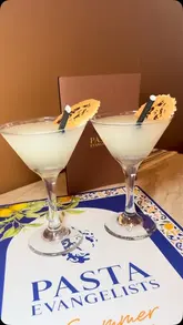 A review of the Pasta Evangelists restaurant in Chelsea, showcasing their summer menu, including cocktails, starters, pasta dishes, and desserts.