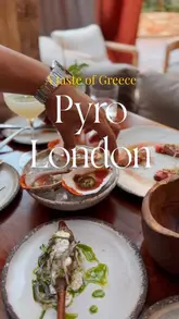 A high-quality, fast-paced montage showcasing the food, cocktails, and interior of Pyro London. The video features close-ups of various dishes, including oysters, grilled prawns, and flatbreads, alongside shots of the stylish venue and staff serving drinks.
