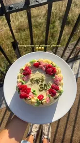 A short, personal video featuring a pistachio, white chocolate, and raspberry birthday cake. The creator shows the cake, cuts a slice, and takes a bite, celebrating a milestone.