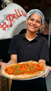 A promotional reel for The Rolling Mill in Birmingham's Jewellery Quarter, showcasing the industrial venue, the kitchen team preparing food, and a variety of dishes including butter chicken pizza, small plates, and truffle fries.