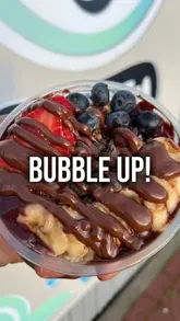 A short, energetic montage showcasing the menu offerings at Bubble Up! in Manchester Fort, including bubble tea, açai bowls, and various sweet treats like waffles and pancakes.