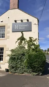 A review of a stay at Hadrian's Hotel in Northumberland, featuring shots of the exterior, the bar and lounge area, the bedroom, and various food and drink items served at the gastropub.