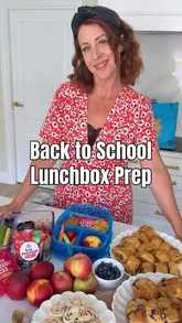 The creator demonstrates a back-to-school lunch preparation routine using products purchased from Aldi. The video includes a quick shopping trip, followed by a step-by-step guide to making muffins, sausage rolls, and tortilla pinwheels, ending with packing the bento boxes.