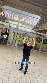 A mother and son vlog their back-to-school shopping trip at White Rose shopping centre, visiting stores like Flying Tiger, JD, and Clarks, followed by a visit to Volcano Falls Golf.