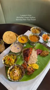 A short, engaging reel showcasing the Michelin-starred Onam Sadhya feast at Jamavar London, highlighting the traditional Kerelan multi-course meal served on a banana leaf.