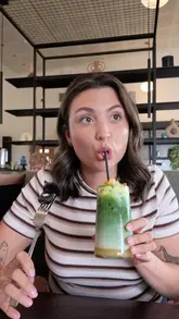 A couple visits a garden centre cafe for lunch, reviewing their drinks and food, followed by a brief tour of the garden centre's retail space.