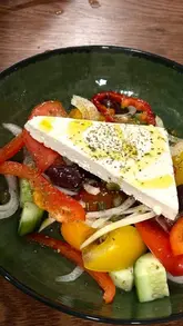 A video review of Arina Meze Bar in Burntisland, featuring the creator trying various Greek dishes including dips, meze, and desserts, while discussing the restaurant's opening and the lack of authentic Greek food in the area.