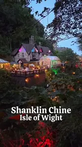 An atmospheric night-time shot of Shanklin Chine on the Isle of Wight, highlighting the venue's evening illumination and natural setting.