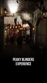 A fast-paced, immersive tour of the Peaky Blinders Underworld experience in London, highlighting the themed sets, interactive games, character interactions, and the Garrison Tavern bar.
