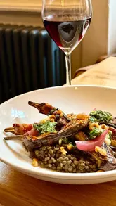 A short, static montage showcasing the interior and various dishes at Whirlybird in Edinburgh, accompanied by a quote about dinner.