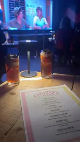 A vlog-style review of a cinema experience at The 3 Stories in Sunderland, featuring a themed menu of cocktails and food paired with a screening of the movie Grease.
