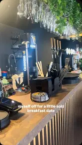 A creator visits a new coffee bar and sando deli called Craft & Crumb in South Shields, showcasing the interior, menu, and their experience eating a breakfast sando and drinking an iced coffee.