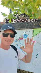 A travel-focused 'day in the life' video exploring various hospitality and leisure venues in Newmarket, including a cafe, a museum, a bakery, an independent cinema, and an Indian restaurant.