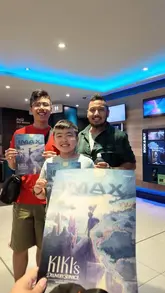 A family vlog documenting a trip to the cinema to watch Kiki's Delivery Service on an IMAX screen, highlighting the nostalgic appeal for parents and the excitement for children.