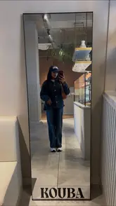 A vlog-style reel following a creator on a 'girly brunch date' in Manchester, visiting Kouba for coffee and Bruncho for a meal.