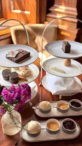 A high-quality, cinematic reel showcasing an afternoon tea service at The Drawing Room in Raffles London. The video highlights the opulent interior, the detailed presentation of the tea service, and the family-friendly nature of the experience.