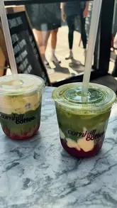 A short, aesthetic reel showcasing Cornhill Coffee, a small coffee stand located next to the Baltic Fleet pub in Liverpool. The video features quick cuts of the venue exterior, the menu board, and the final iced matcha drinks.