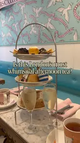 A short, edited reel showcasing a limited-edition Moomin-themed afternoon tea experience at Biscuiteers in Notting Hill, featuring close-ups of the food, the venue's interior, and the creator enjoying the tea.