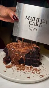 A montage of various brunch and dessert items at Haute Dolci, including a chocolate cake, pasta, a toasted sandwich, and a breakfast platter, set to music with text overlays highlighting the menu.