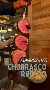 A review of Fogo de Chão in Edinburgh, highlighting the Brazilian steakhouse experience. The video features tableside meat carving, a variety of dishes including seafood and lobster mac and cheese, cocktails, and the restaurant's interior.