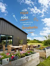 A bright, inviting promotional image for Groobarbs Field Kitchen, showcasing the outdoor dining area and the countryside setting.