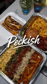 A fast-paced montage showcasing a variety of dishes from a takeaway venue, including steak, mac and cheese, smash burgers, wings, and mocktails. The video focuses on close-up shots of the food to highlight texture and quality.