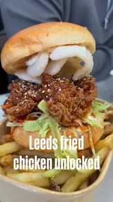 A couple visits Wing-A-Ding in Leeds to try their fried chicken, showcasing the exterior, interior, and various menu items including a burger, wings, and mac & cheese.