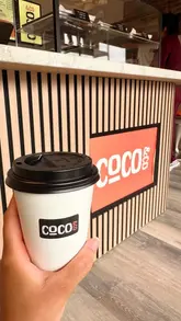 A short, handheld tour of a new independent coffee shop in Fenham, Newcastle, showcasing the interior, menu, merchandise, and a selection of pastries and coffee.