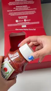 A short, polished product demonstration video showcasing the new Heinz 'Love Lid' attachment, which allows users to adjust the flow of ketchup using three settings: 'Like', 'Love', and 'Crazy Love'. The video demonstrates the mechanism by twisting the lid and squeezing the ketchup onto a chicken tender.