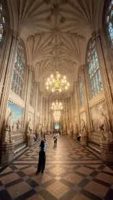 A cinematic tour of the Palace of Westminster, showcasing the interior architecture and historical significance of the building, accompanied by informative text overlays.