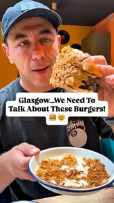 A fast-paced food review video featuring a visit to Smokey Trotters Kitchen in Glasgow. The creator highlights their unique burger combinations, including the 'Dirty Dipper' with haggis and peppercorn sauce, and the 'Dippin Chicken' with salt and chilli fried chicken. The video also showcases various sides like mozzarella sticks, Vietnamese-inspired loaded fries, and onion rings, emphasizing the variety of textures and flavours.