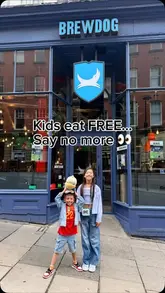 A family-focused promotional video for BrewDog Newcastle, highlighting their 'Kids Eat Free' offer. The video features shots of the venue's interior, the menu, children customizing their own pizzas, and the family enjoying a meal while watching football on the venue's screens.