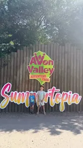 A montage-style video documenting a family day out at Avon Valley Adventure Park, featuring various activities like mini-golf, go-karts, animal encounters, and playground games, concluding with a casual lunch.