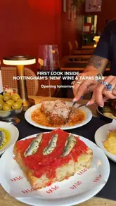 A promotional video showcasing the interior, exterior, and food/drink menu of Vaso, a new wine and tapas bar in Nottingham. The video features close-ups of various tapas dishes, wine pouring, and the venue's vibrant red-themed decor.